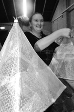 Laura Kendall tending lanterns.jpg